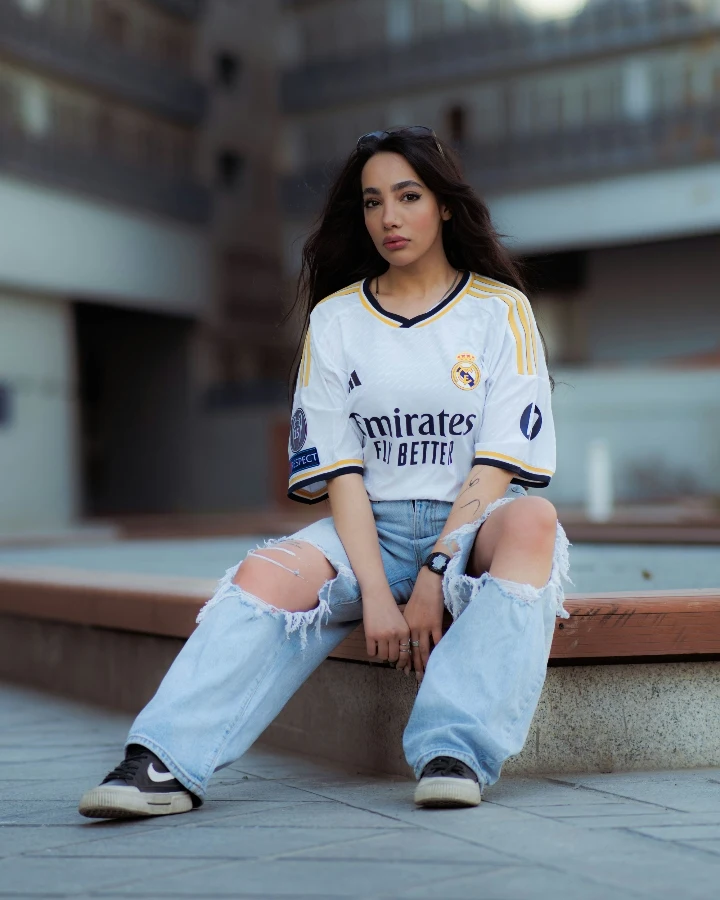 Streetwear-inspired custom football shirts shown in a casual fashion look, illustrating how football shirts shape the Blokecore aesthetic