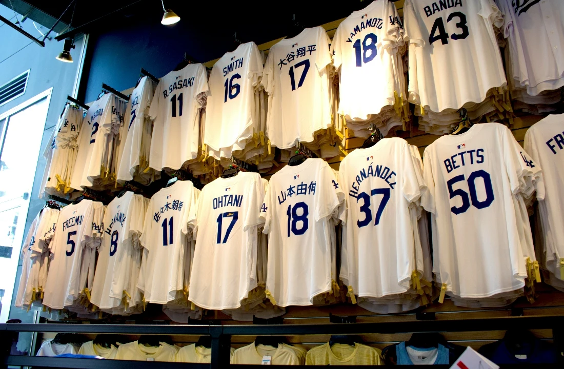 Custom sports jerseys displayed on a retail wall, suitable for discussing jersey silhouettes, fabric selection, number placement, and premium custom team jerseys for streetwear-inspired collections