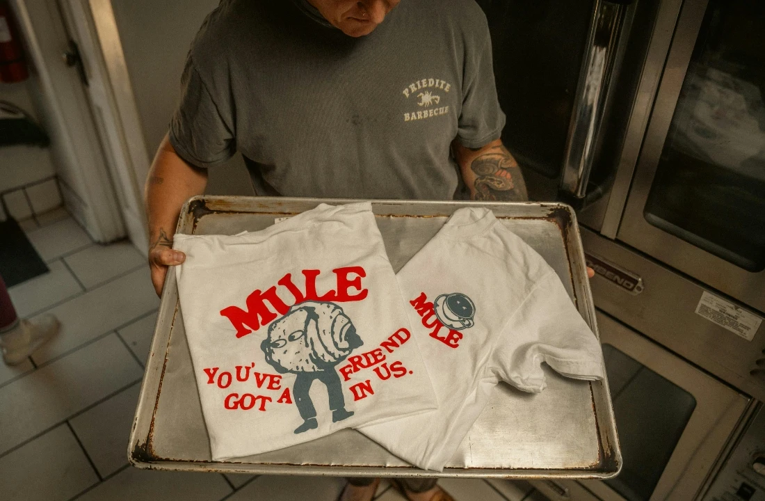 Printed custom sports shirts placed on a production tray, suitable for World Cup apparel printing, custom soccer shirts, and campaign apparel production