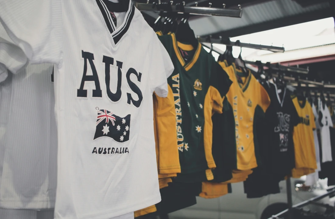 Custom Football Shirts retail display showing jersey-style apparel on a rack, suitable for explaining how football culture can inspire a clean streetwear capsule with original design direction