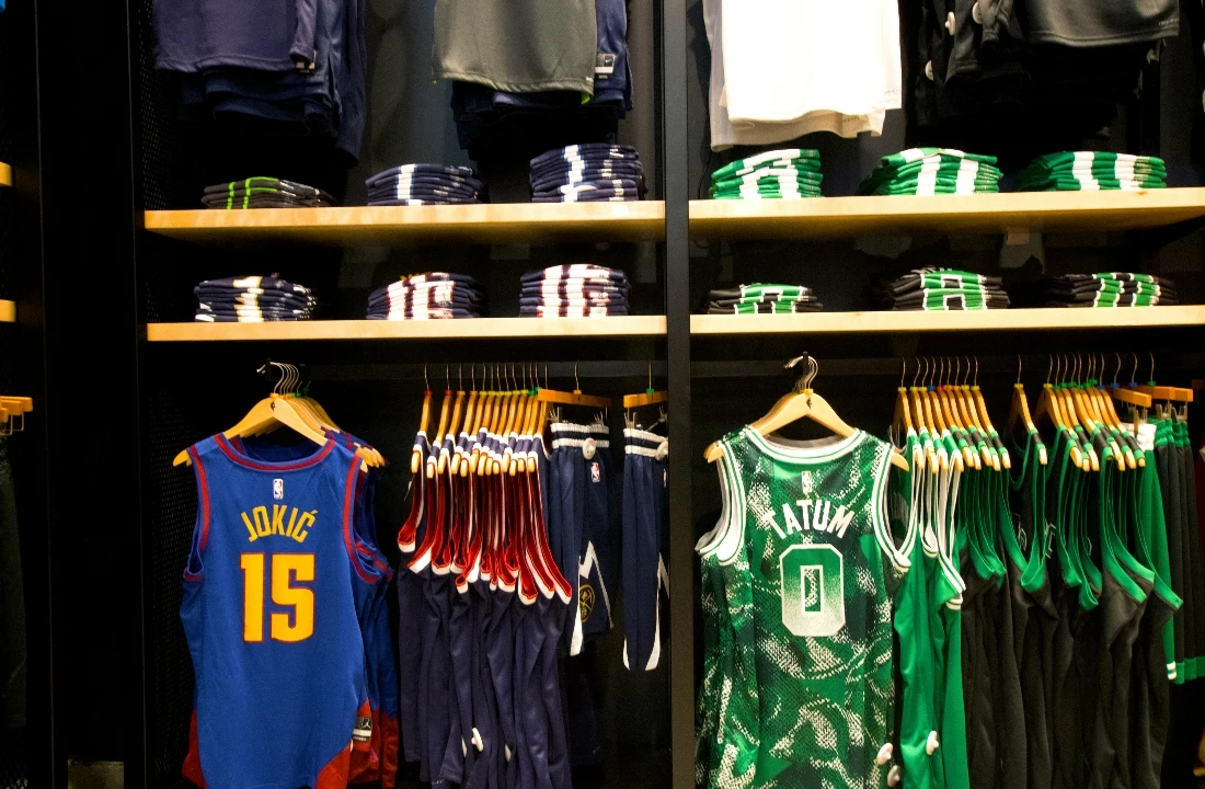 Fan Club Shirts image showing basketball jerseys and matching apparel displayed in a retail store, suitable for basketball fan club shirts, custom sports team shirts, and sports merchandise collections