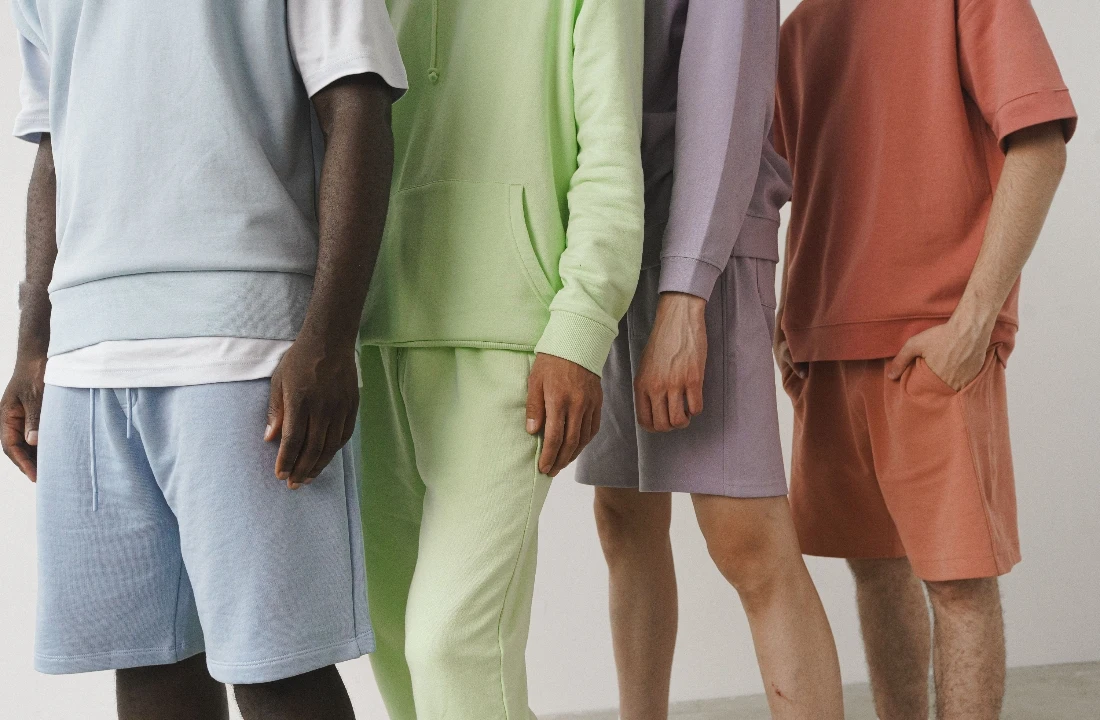 Close-up of models wearing coordinated pastel streetwear shorts and matching tops