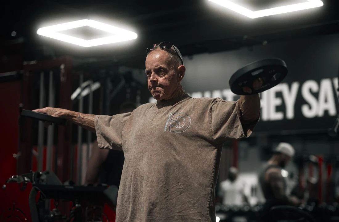 Older man wearing washed t shirts during a gym workout, showing a durable heavyweight casual fit
