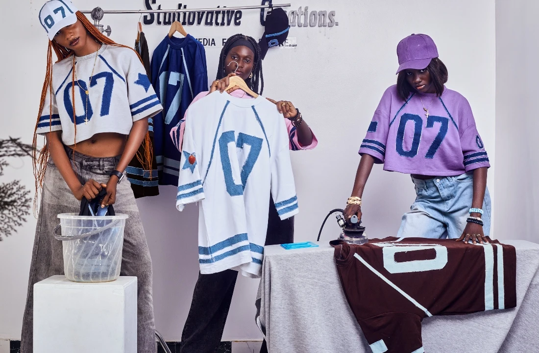 Models presenting custom jersey-style apparel, showing creative production support from a print on demand supplier