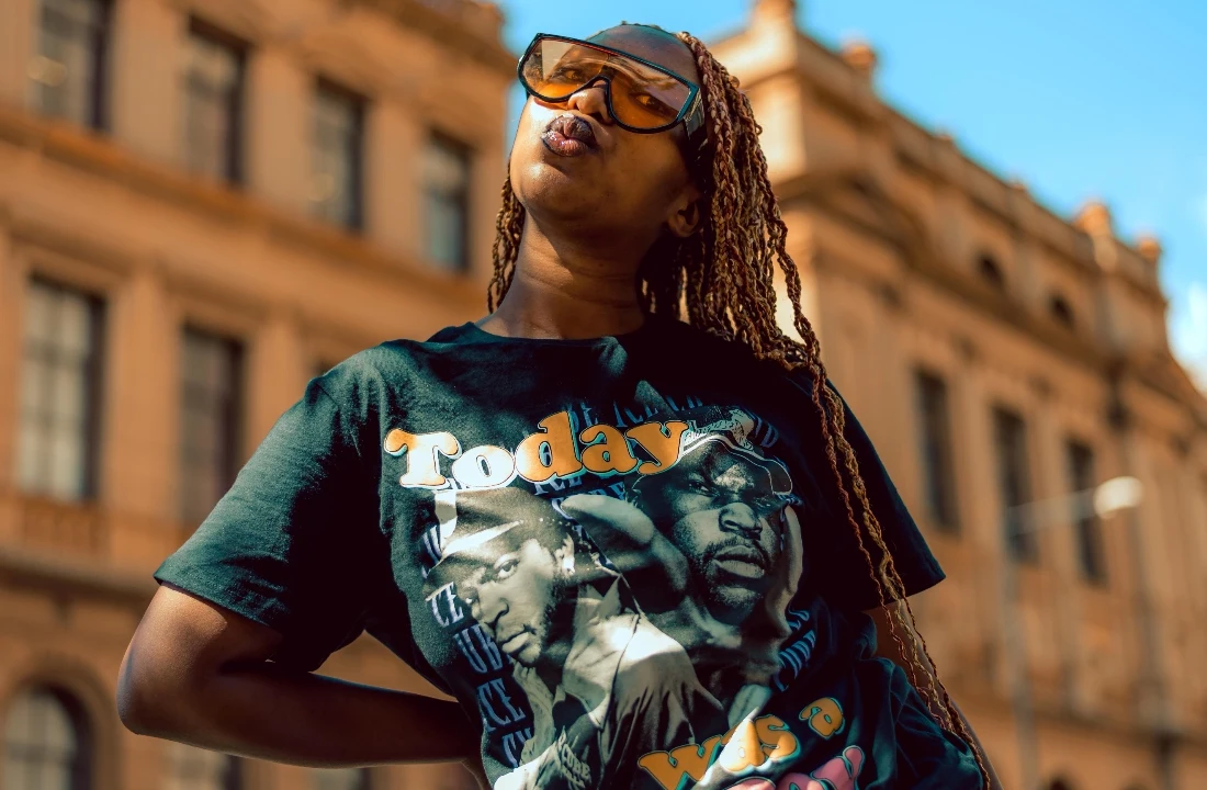 Model wearing an oversized printed T-shirt, showing fashion-forward apparel styling from a print on demand supplier