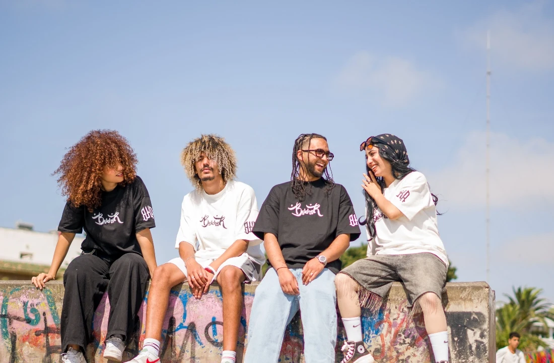 Group of models wearing coordinated graphic T-shirts, showing brand-ready streetwear from a print on demand supplier