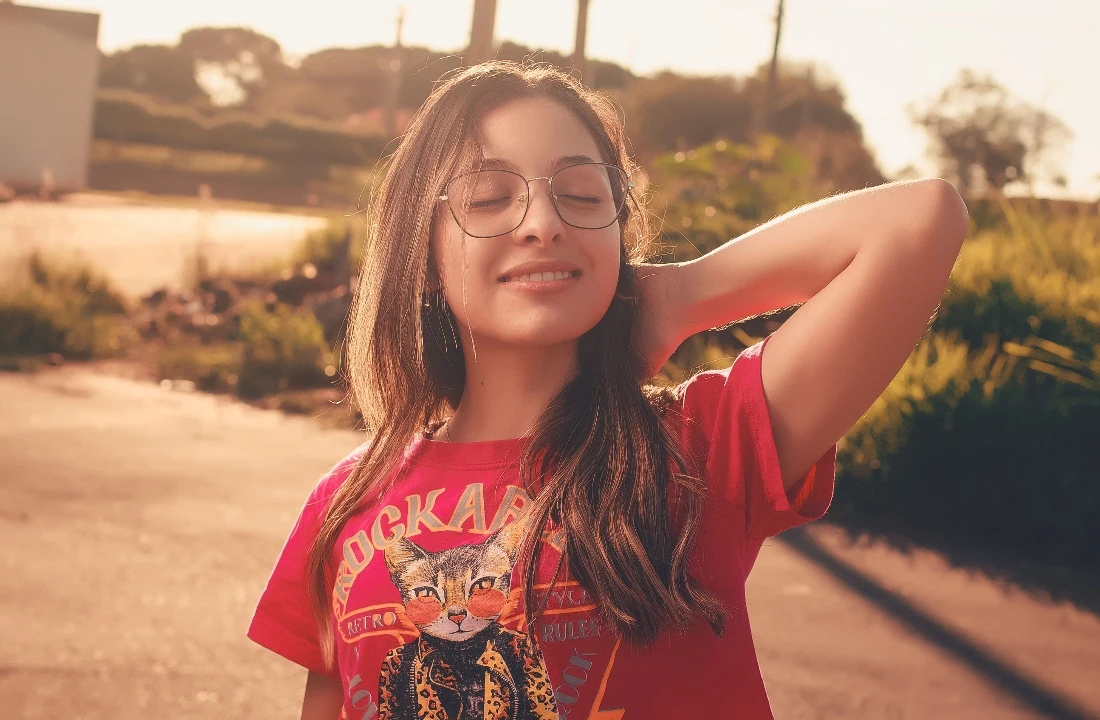 Woman posing outdoors in a red T-shirt with a detailed retro cat Jumbo Print design
