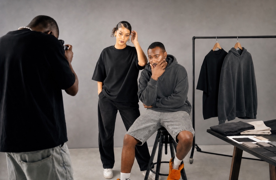 Creator merch T-shirt and hoodie capsule photographed in a studio