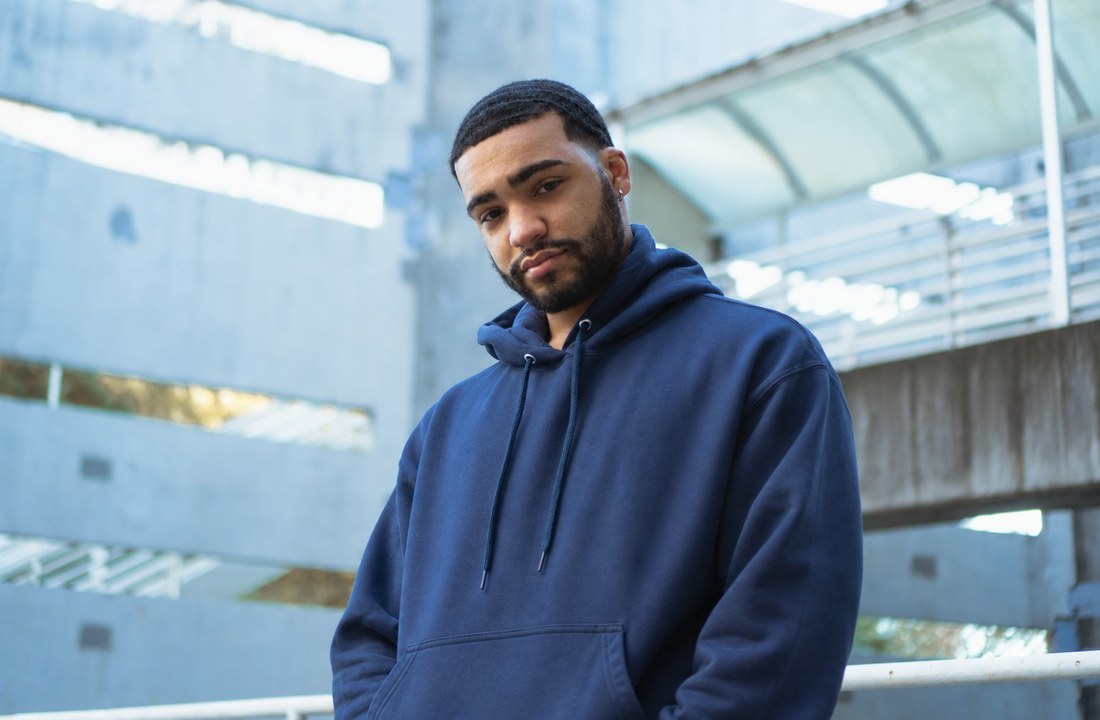 Streetwear model wearing a navy heavyweight hoodie for holiday apparel inventory planning