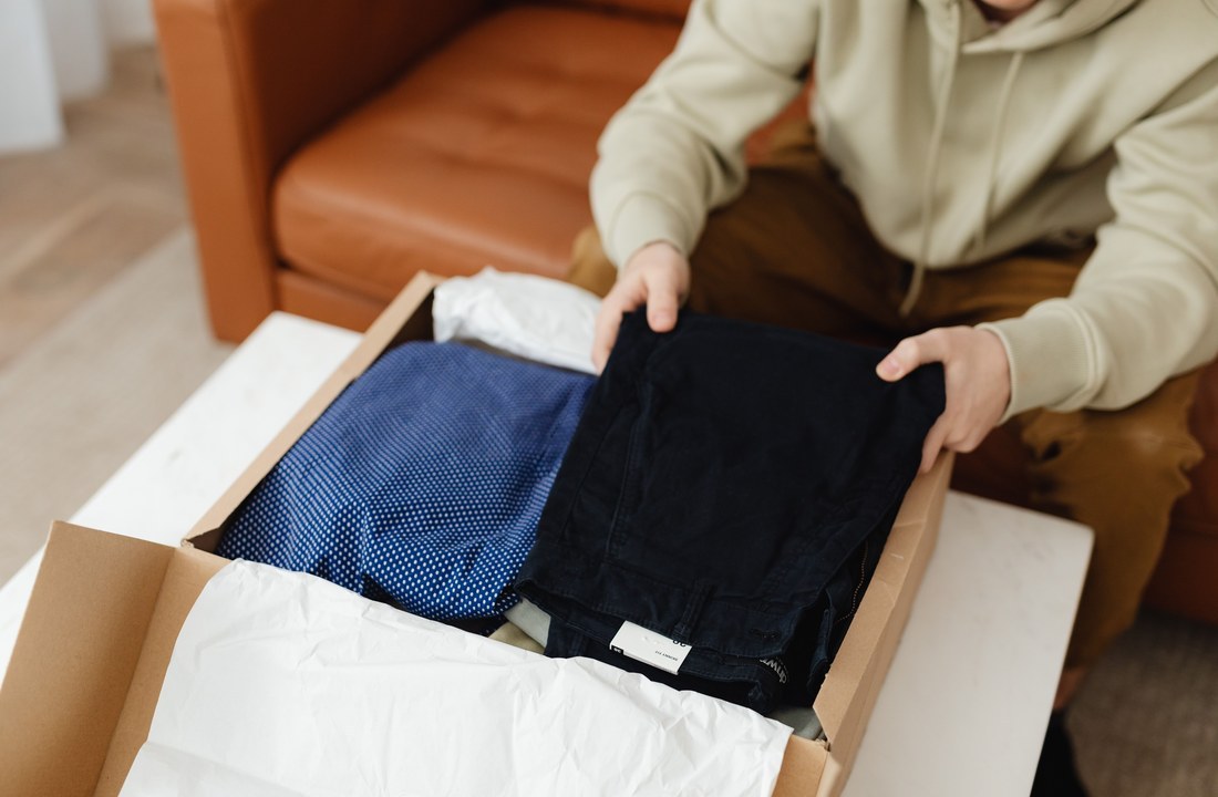 Folded garments being packed for holiday apparel peak-season readiness