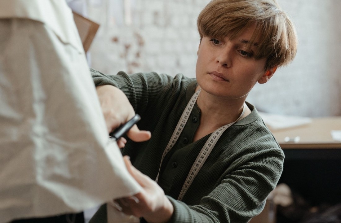 Custom apparel supplier conducting a fall and winter garment fitting review