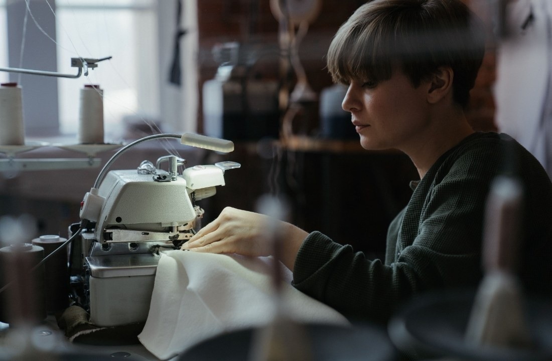 Apparel worker sewing a garment during supplier workmanship quality control