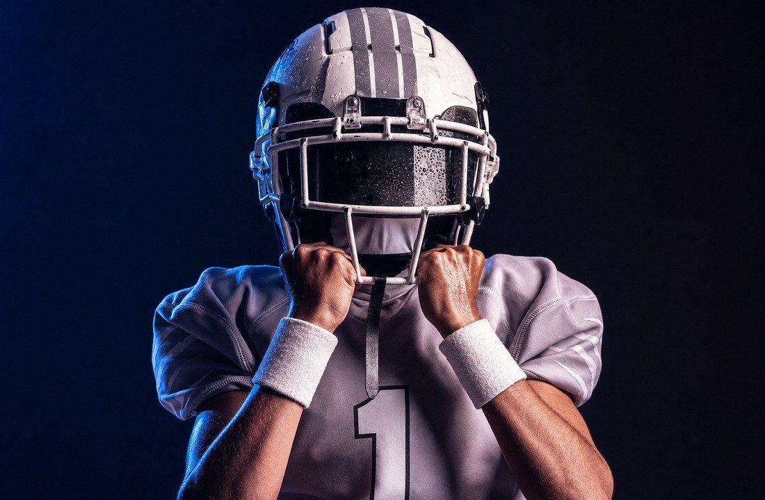 American football player posing in a coordinated alternate uniform