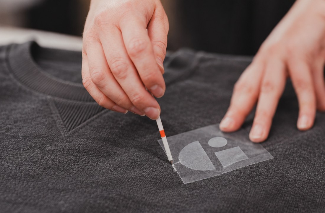 Simple logo placement traced on a sweatshirt panel