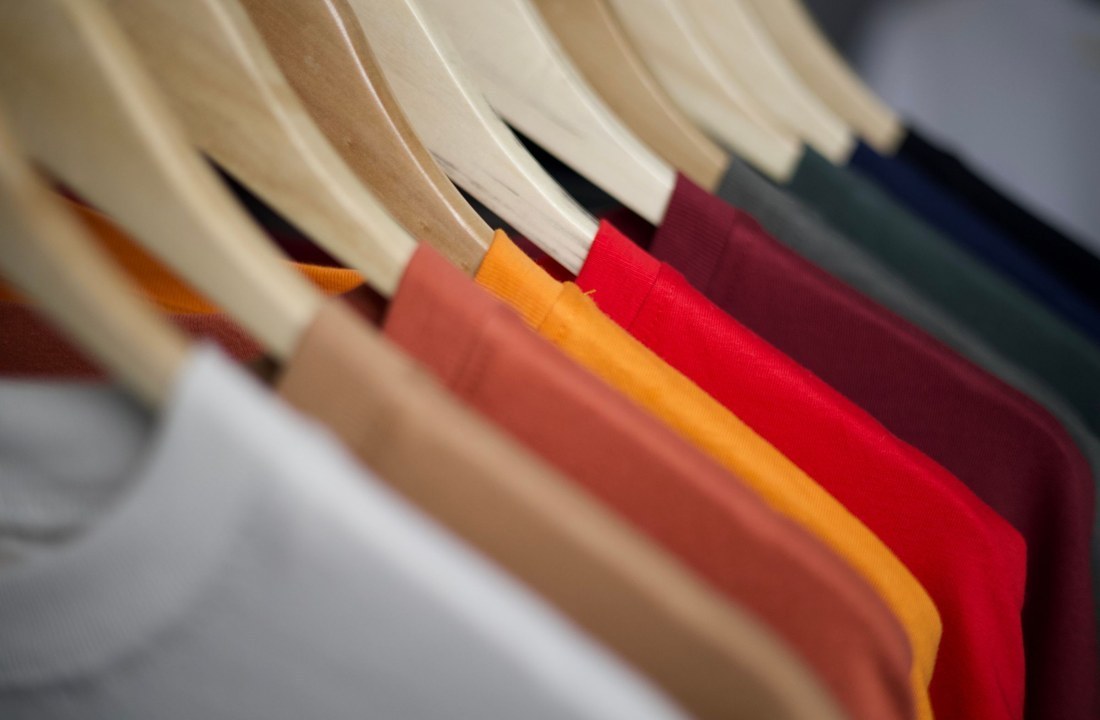 Plain shirt colors compared on a clothing rack