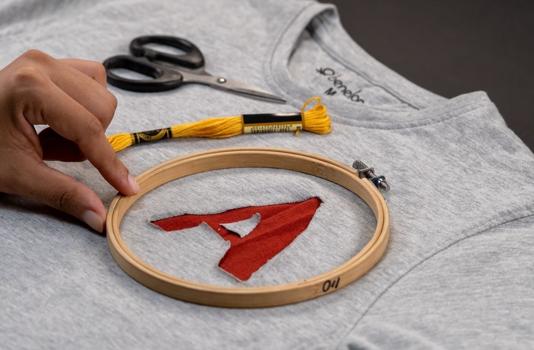 Hand embroidery applied to a gray garment
