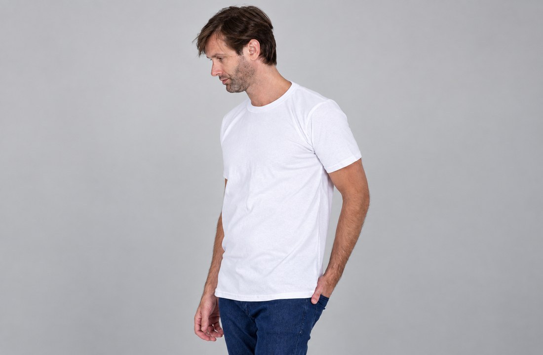 White crewneck T-shirt showing sleeve length, torso fit and hem on a model