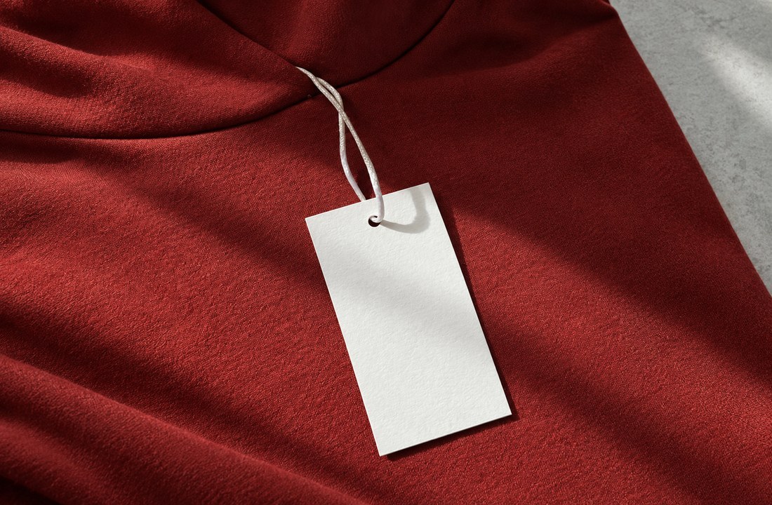 Blank paper hangtag attached to a red jersey garment